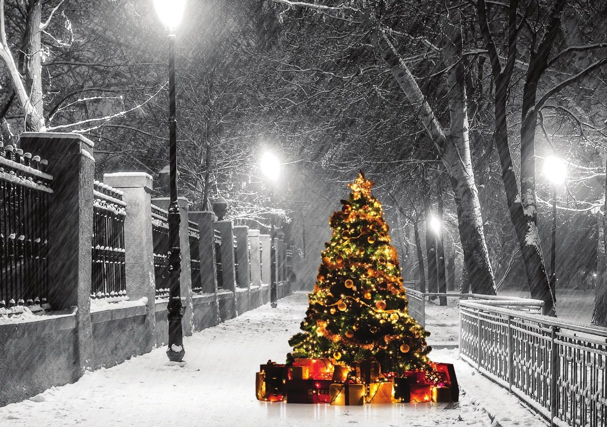 Christmas card with a glowing tree on a snowy street